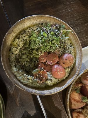 hummus bowl with fermented radish, sunflower seeds and herbs  at Sa Placeta in Illes Balears