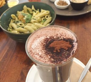 Kale-pesto penne, bread and dips with almond milk hot chocolate at Radhey Chai Bar in Fitzroy