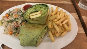 Tandoori wrap with chips and salad  at Radhey Chai Bar in Fitzroy