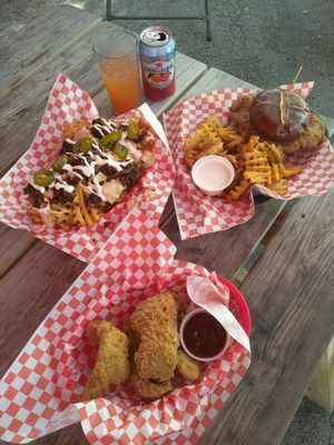 Buttamilk chik'n tenders, loaded fries, and buttamilk chik'n sandwich at Atlas Meat-Free Delicatessen in Miami