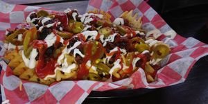 Loaded fries at Atlas Meat-Free Delicatessen in Miami