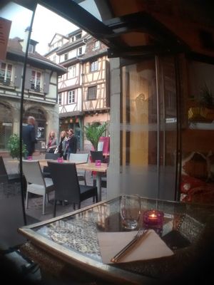 A window seat at Le Touareg. The tables have an interesting Middle-Eastern pattern. The candles and other interior make for a cosy atmosphere. at Le Touareg in Colmar