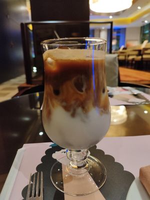 Almond milk iced latté at Caramel Lobby Lounge in Doha Municipality
