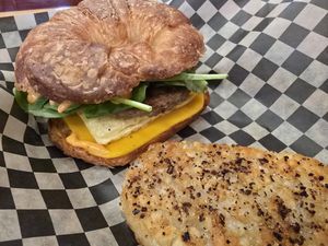 Breakfast sandwich with a croissant at The Dusted Cup in Portland