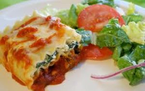 Three CHEESE SPINACH LASAGNA complimented with the Garden House Salad at Island Pizzeria in Tacoma