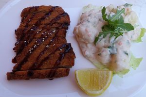 Schnitzel with potato salad at Loving Hut Pension in St Kanzian