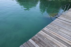 Lake Klopein and its pier at Loving Hut Pension in St Kanzian