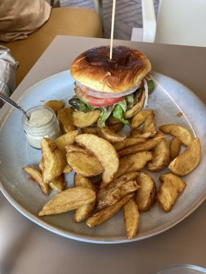 Vegan burger with chickpea patty and potato wedges  at Café Melita - Palmelita in Tenerife