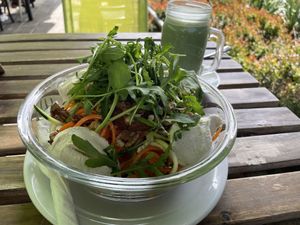 Raw vegetable spaghetti with dry tomato pesto, and matcha latte at Vege Miasto in Warsaw