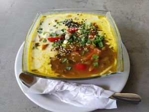 Spicy soup, with rice pasta, coconut oil, chilli, coriander and orange at Vege Miasto in Warsaw
