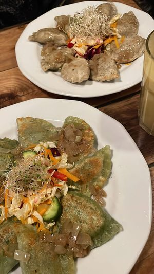 Fried spinach tofu pierogi (front) & cooked mushroom sauerkraut pierogi (back)  at Vege Miasto in Warsaw