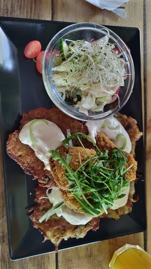 Potato cakes with fried mushrooms. at Vege Miasto in Warsaw