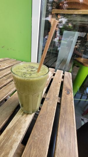 Green Raw Juice with grass, avocado, aso. and chia seeds on top. at Vege Miasto in Warsaw