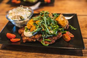 Polish dish called "Placki ziemniaczne" - potato 'pancakes' wish mushroom sauce #Veganuary at Vege Miasto in Warsaw