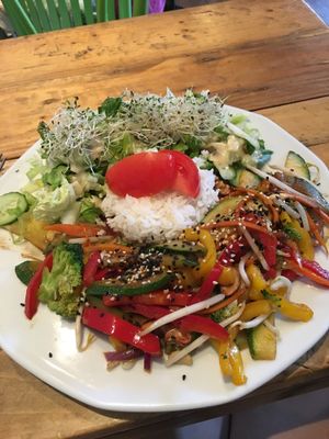 wok vegetables with rice and side salad at Vege Miasto in Warsaw