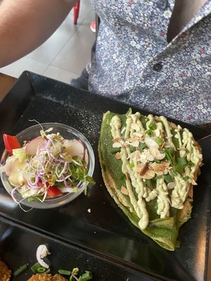 Green pancakes with cashew cream, tofu and onions  at Vege Miasto in Warsaw