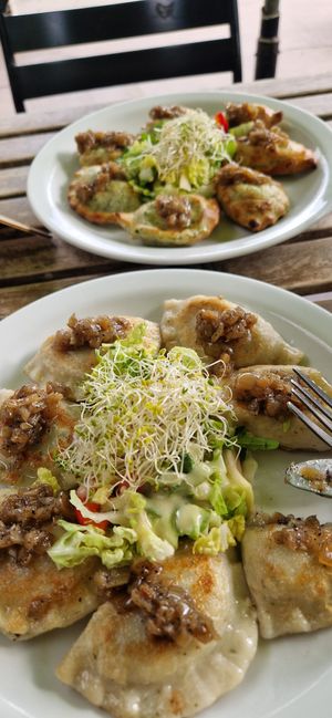 Mushroom pierogi and think spinach. at Vege Miasto in Warsaw