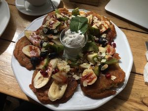 Pancakes with fresh fruit and coconut cream at Vege Miasto in Warsaw