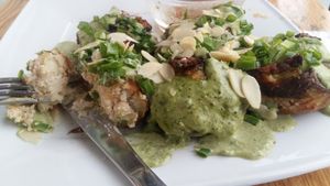 Cudaki-stuffed potatoes with sauce at Vege Miasto in Warsaw