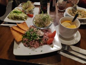 In the main place, the risotto and the reeeaaallly nice "warming hot drink", with ginger and fruits. In the back, the "green heaven", amazingly good too. at Vege Miasto in Warsaw