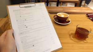 Browsing the menu with a glass of Turkish tea at Roka in Leiden