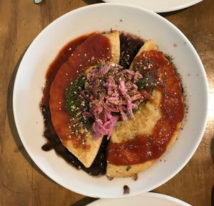 Picadillo Empanada - jackfruit and cashew cheese empanada served over black beans with chimichurri and harissa. delicious and filling.  at Mesa Verde in Santa Barbara