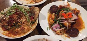 Amazing vegan cashew lasagne to the left with zaatar flatbread / more ordinary harissa cauliflower to the right  at Mesa Verde in Santa Barbara