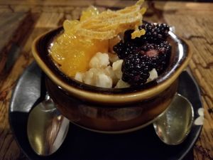 Panna Cotta with Macadamia Nuts, Fresh Blackberries, Orange Slices, & Candied Orange Peel. Delish & Vegan. at Mesa Verde in Santa Barbara