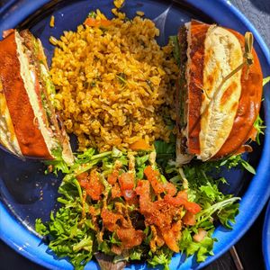 The award-winning mushroom burger. Comes with lots of salad and rice so large enough to share. 🍄 at True Vegan in Delray Beach
