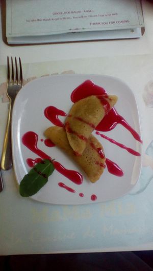 Jaw-droppingly excellent Kataif Ramadan from Malak - pancake stuffed with nuts, cinnamon, coconut and sugar, drizzled with raspberry sauce. I don't expect to eat anything this fine again this side of heaven! :-) at Malak in Santiago De Compostela