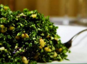 chopped vegan kale salad with tofu feta and pine nuts and pumpkin seeds topped with lemon dressing  at GustOrganics in New York City