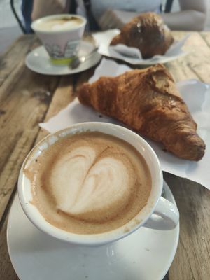 Soy cappuccino and apricot jam croissant at Caffe Trastevere in Rome