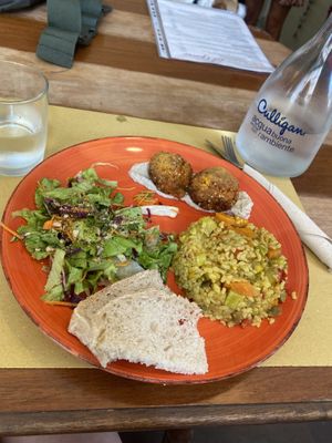veggie rice with lentils and a tofu cutlet served with a green salad  at InFusion in Genoa