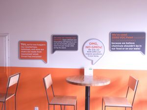 Signs explaining Next Level Burger at Next Level Burger in Bend