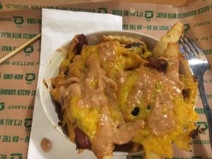 Special fries - cheese, “special sauce” and grilled red onions. - they were sweet like shallots at Next Level Burger in Bend