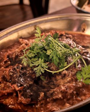 Shredded beef in red wine, confit fillet, shallots, gondino and chervil, my favorite dish, with an amazing texture and taste. We finished the plate with the delicious sauce! at Présent in Paris