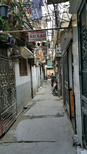 You have to go down a narrow alley, including two bends, until you see this sign. at Au Lac - Duong Lang in Hanoi