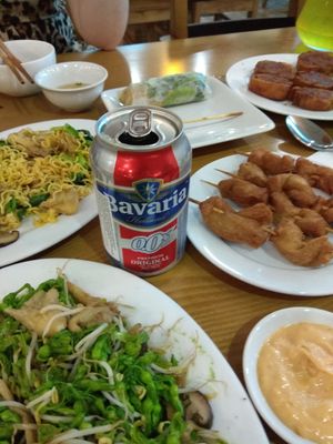 Vegetable dish, baked noodles, skewers and imitation pork chop at Thien Truc in Hai Duong