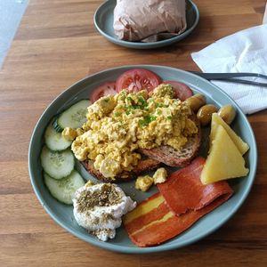 Green oasis - delish tofu scramble, halloumi, coconut labneh, veggies, facon at 1947 in Boronia