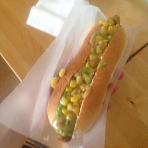 Tofu dog with guacamole, corn, and mustard at The Dog is Hot in Barcelona