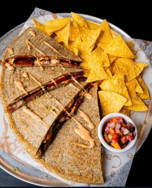 Pizzadilla con la proteína de elección. at Rinconcito Vegano in Bayamon
