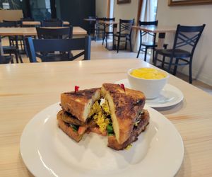 French Toast Breakfast Sandwich with a Bowl of Polenta. at Soul Vegan in Chicago