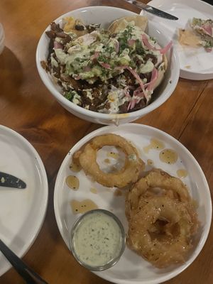Burnt end nachos and tempura squash donuts (minus a few bites 🤭)  at Dreamstate Cafe in Minneapolis