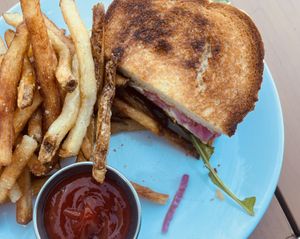 Roasted Delicata Sandwich with “Tofu Mozzarella, Pickled Red Onion, Mojo Verde Aioli, Dressed Arugula, Sourdough"  at Dreamstate Cafe in Minneapolis