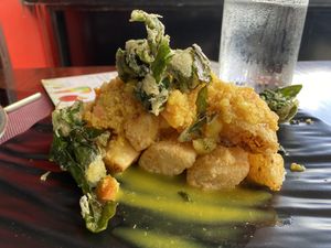 Fried cassava with quinoa salsa  at Chifa La Familia Feliz in La Fortuna