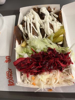 Vegan Donner tray with vegan mayo, chips and all sides of pickles and cabbage   at Great British Doner in Manchester