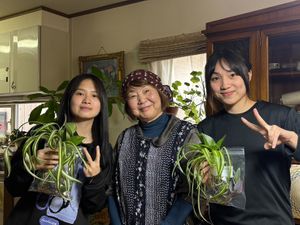 A warm group moment after cooking traditional regional Japanese dishes—enjoy the friendly, home-like atmosphere with locals. at BASAMA's Kitchen in Tsuruta