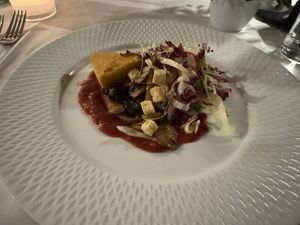 Baked polenta with leaf salad, chutney, mushrooms  at Restaurant Stella Freiburg in Freiburg