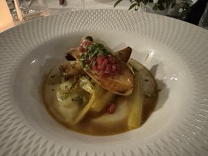 Golden fennel with celery cream, king oyster mushrooms, pomegranate  at Restaurant Stella Freiburg in Freiburg