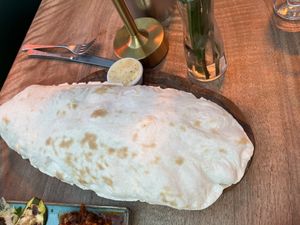 Beautiful freshly baked flatbread   at Olive & Thyme in Manchester